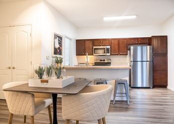 a kitchen and dining area in a 555 waverly unit at Waterstone Landing, Perrysburg, 43551